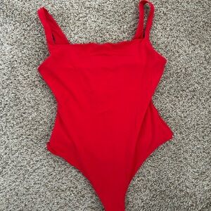 Skims red bodysuit